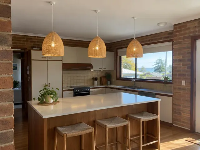 Three woven pendant lights above a kitchen island in a brick home interior in Long Jetty